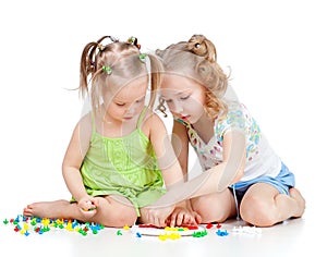 Two kids sisters play together