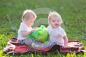 Two kids on a sunny summer day on the lawn