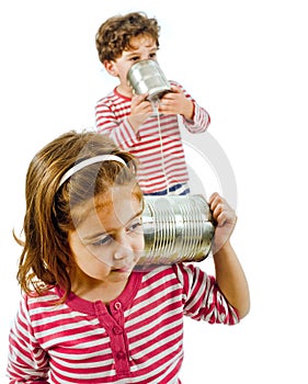 Two kids talking on a tin phone