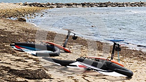 Two kite surfing boards and sail on the shore in Narraganssett Rhode Island