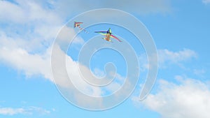 Two kites flying in blue sky