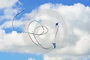 Two kites flying in formation