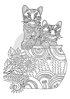 Two kittens in cup. Hand drawn cat. Sketch for anti-stress coloring page.