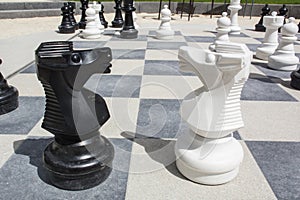 Two knights on the street chessboard with chessmen