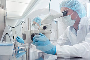 Two lab technicians or scientists working in laboratory