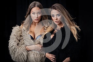 Two ladies in fur coats