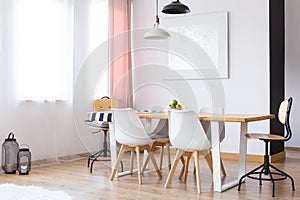 Two lamps hanging over table