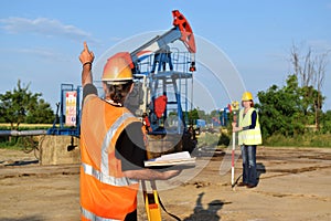 Two land surveyors at work