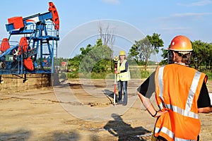 Two land surveyors at work