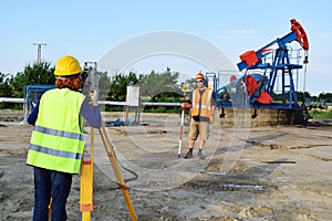 Two land surveyors at work