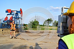 Two land surveyors at work