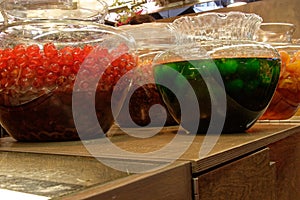 Two large bowls of glace fruits on a table