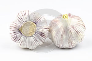 Two large heads of garlic isolated on a white background