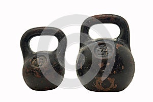 Two large heavy cast iron weights on a white background
