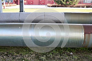 Two large pipes in isolation from tin on the oil refinery, petrochemical, chemical plant background