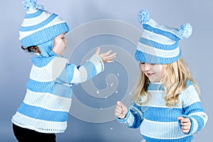 Two laughing girls in snow