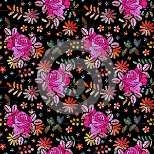 Two layered embroidery with roses on the background of wild flowers. Floral seamless pattern. Fashionable design. Print for fabric
