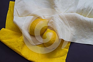 Two lemons on cloth