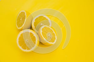 Lemons on yellow background