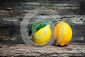 Two lemons placed on the wooden floor