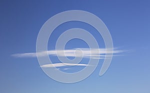 Two Lenticular Clouds on Clear Blue Sky