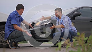 Two lifestyle men arguing conflict after a car accident on the road car insurance. slow motion video. Two Drivers man