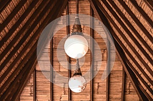 Two light bulb under the roof