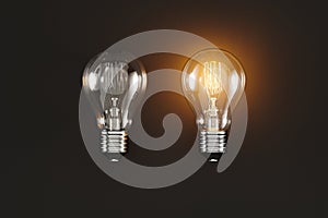 Two light bulbs on a black background, light bulbs on and off, idea or sign, source or banner