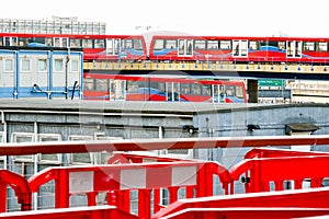 Two light trains crossing each other in Canary Wharf