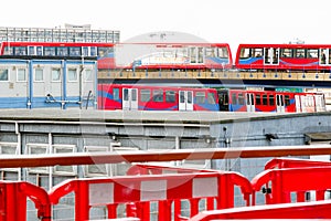 Two light trains crossing each other in Canary Wharf
