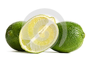 Two limes with half of a juicy lime