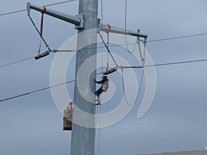 Linemen Work On High Voltage Lines