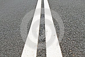 Two lines on asphalt road