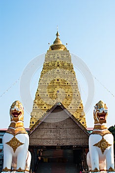 Two Lion guard statues in Wang Wiwekaram Thai temple, Sangklaburi, Kanchanaburi, Thailand