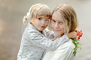 Two little beautiful girls sisters hug, close-up portrait