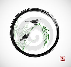 Two little birds sitting on bamboo branch in black enso zen circle. Traditional oriental ink painting sumi-e, u-sin, go