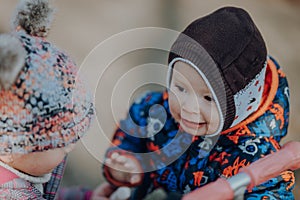 Two little children playing on the playground