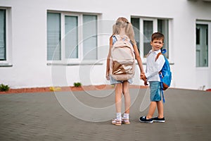 Two little friends go to school. Schoolchildren. back to school