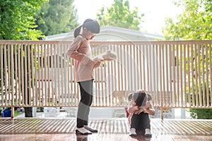 Two little girl fighting over bear