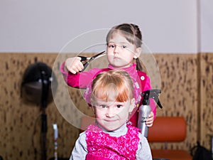 Two little girls in barbershop