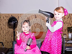 Two little girls in barbershop