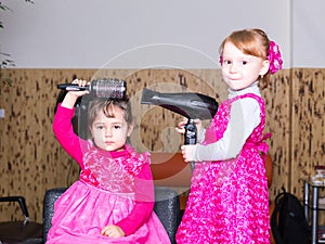 Two little girls in barbershop