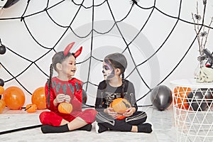 Two little girls in costumes for Halloween