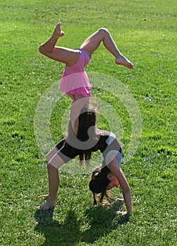 Two little girls exercising