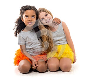 Two little girls-friends with different complexion