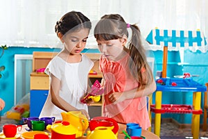 Two little girls playing in daycare