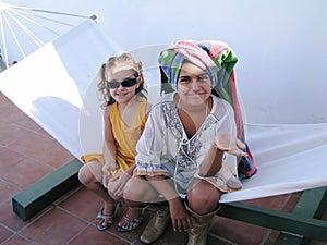 Two little girls are playing in a hamaca photo
