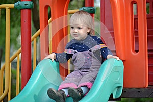 Two little girls playing on playground