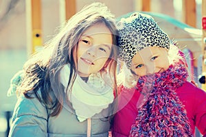 Two little girls posing at playground