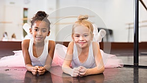 Two little girls practicing ballet elements